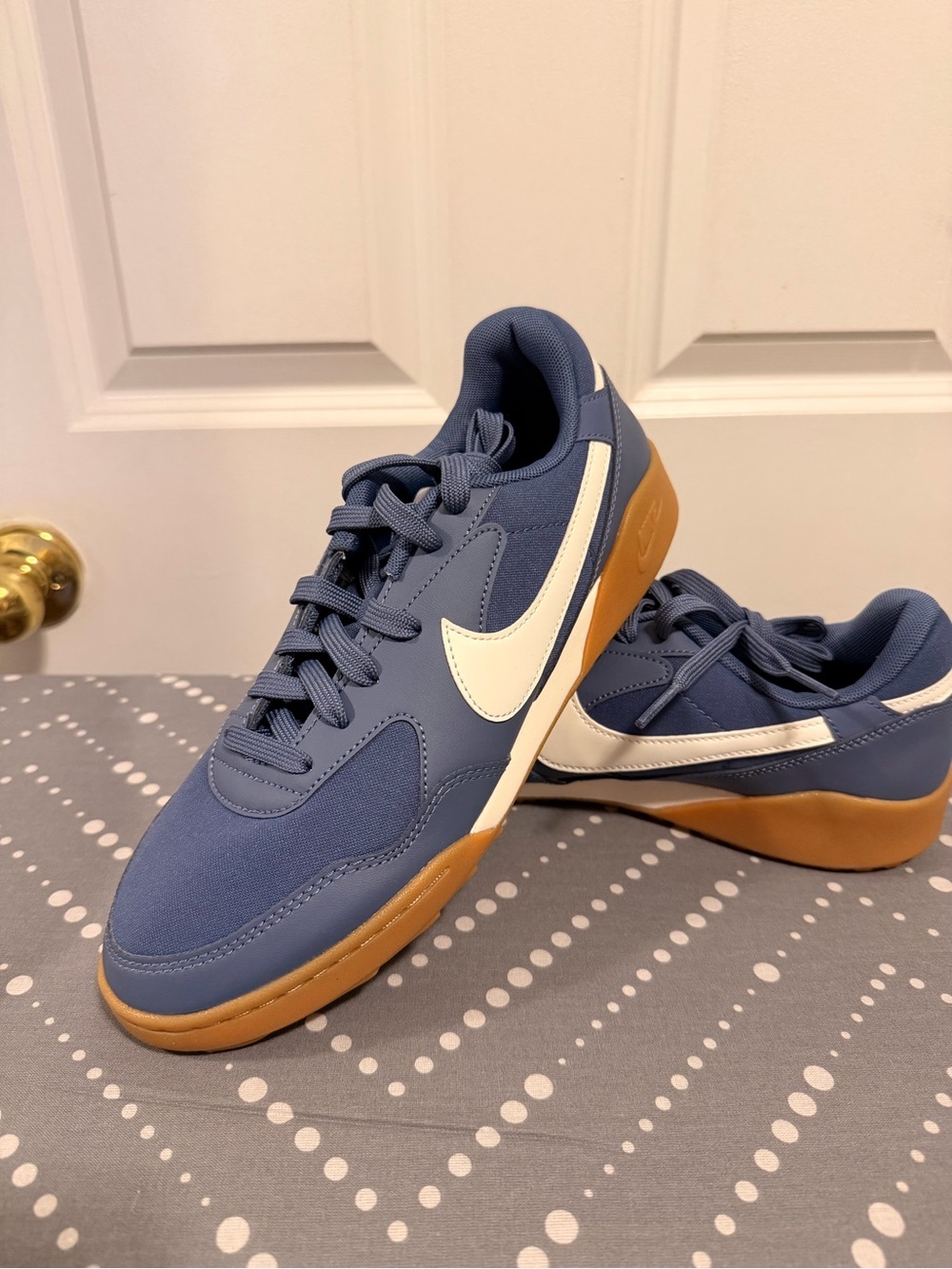 Nike Court Legacy 2.0 sneakers in blue with white Nike swoosh and gum sole